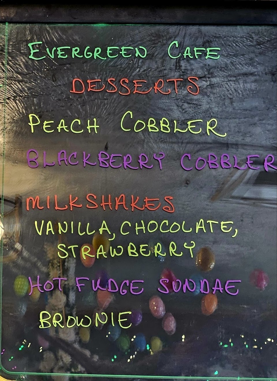 Cafe menu items with coffee and breakfast sides.